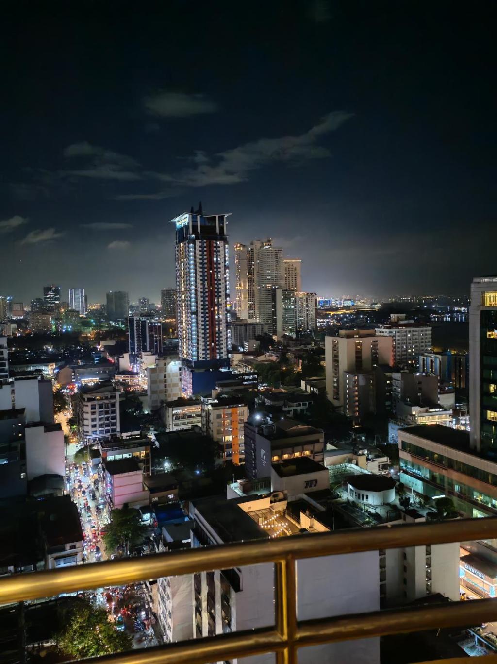 Guest photo — Manila skyline at night from a balcony