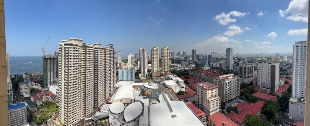 Guest photo — daytime panorama of Manila Bay and the city