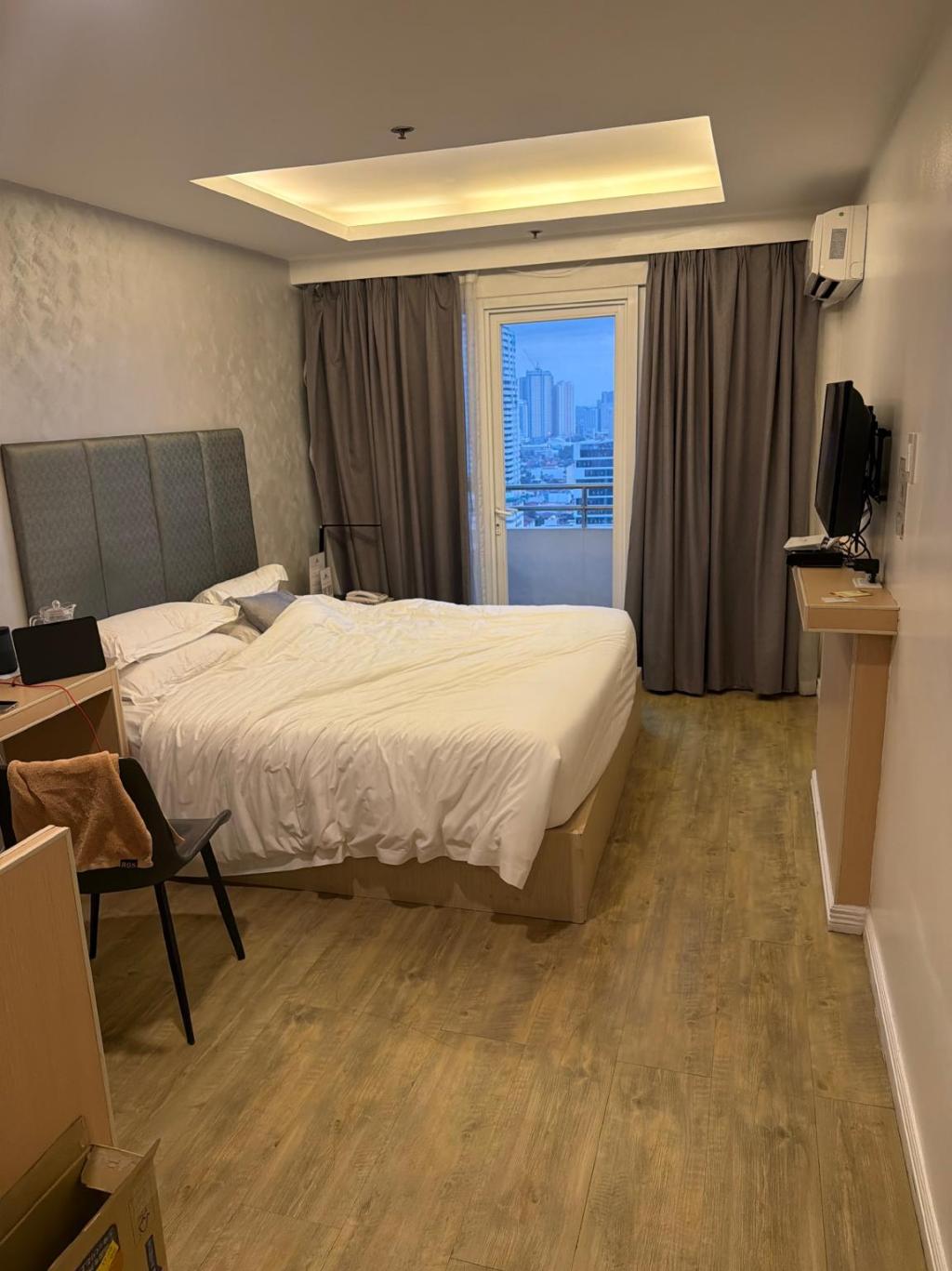 Guest photo — suite with balcony view at dusk